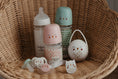 Load image into Gallery viewer, Baby bottles and pacifiers on a wicker chair