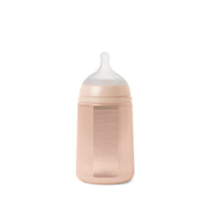 A marshmallow nude Suavinex Color Essence silicone baby bottle with a medium flow nipple.